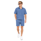 Model walking – WEELZ petrol-blue textured V-collar shorts set
