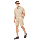 Model walking – WEELZ beige button-collar cotton shorts set