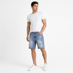 WEELZ light blue distressed denim shorts styled on model 1
