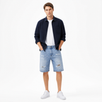 WEELZ light blue distressed denim shorts styled on model 2