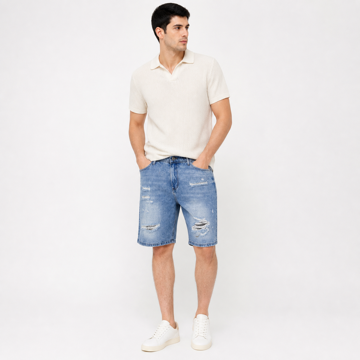 WEELZ light blue distressed denim shorts styled on model 3