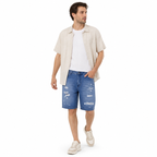 WEELZ Relaxed-Fit Distressed Denim Shorts — Mid Blue styled model view 1