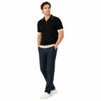 WEELZ Geometric-Collar Zip Knit Polo in Black & Cream — styled with indigo denim