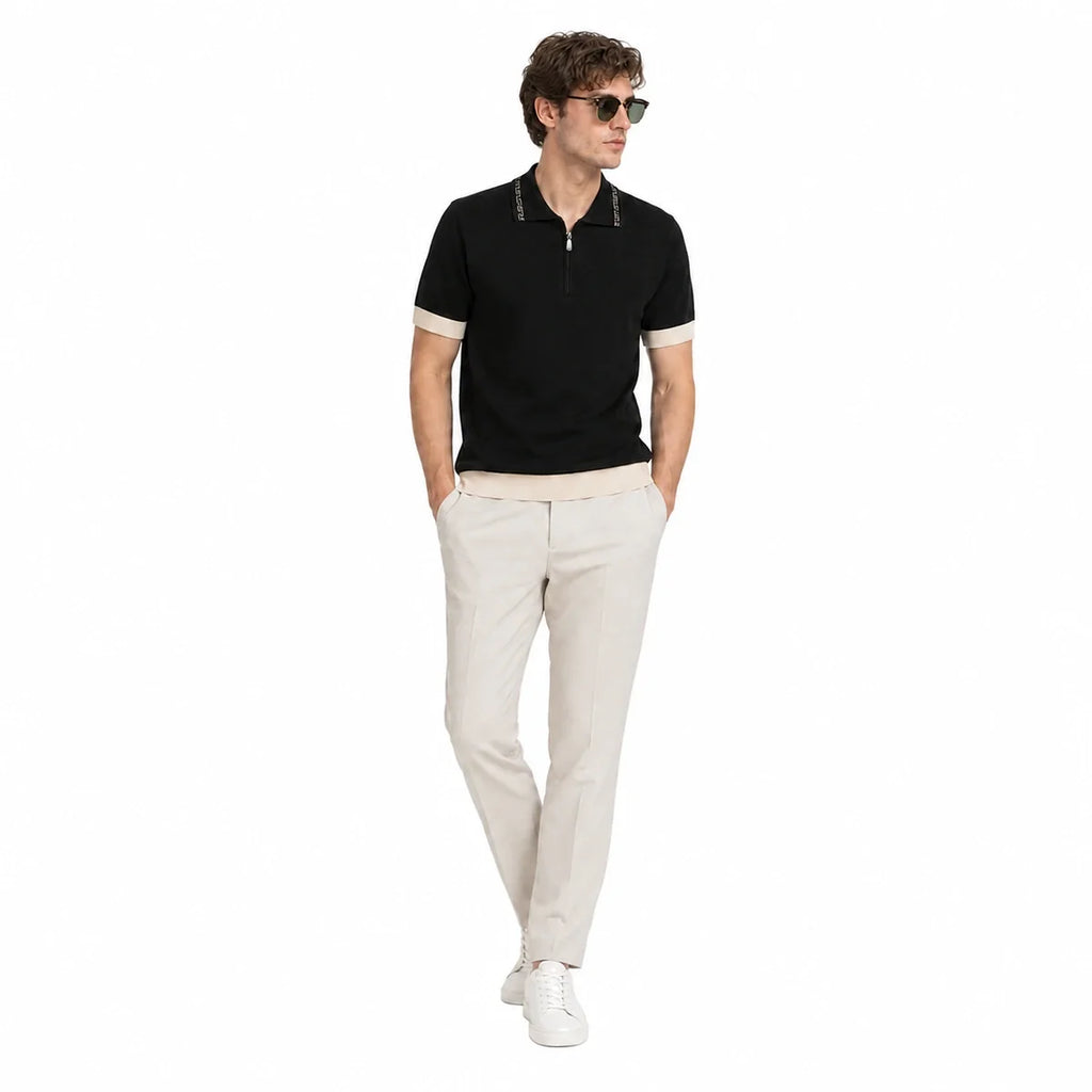 WEELZ Geometric-Collar Zip Knit Polo in Black & Cream — styled with stone trousers