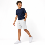 WEELZ Kids Sweat Shorts — White, styled on child model with navy tee