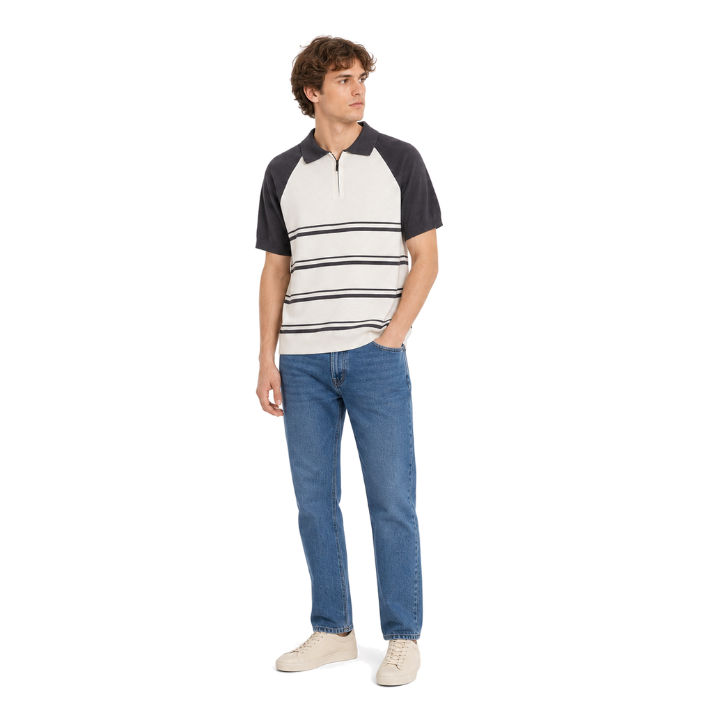 WEELZ grey and off-white raglan stripe zip knit polo worn with medium blue denim jeans