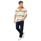 WEELZ cream and tan striped V-neck knit polo worn with indigo jeans