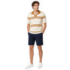 WEELZ cream and tan striped V-neck knit polo worn with navy chino shorts